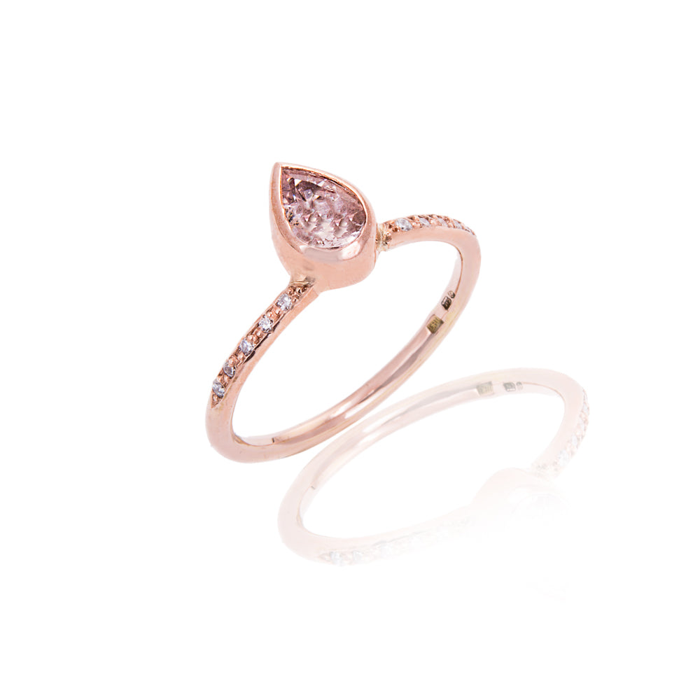 Dainty rose gold engagement ring with teardrop morganite and flush diamond shoulders