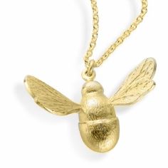A large gold bumblebee pendant with outstretched wings on a gold linked chain
