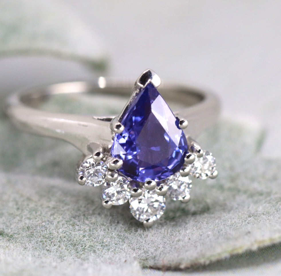 Pear shaped purple sapphire and diamond ring with white shank