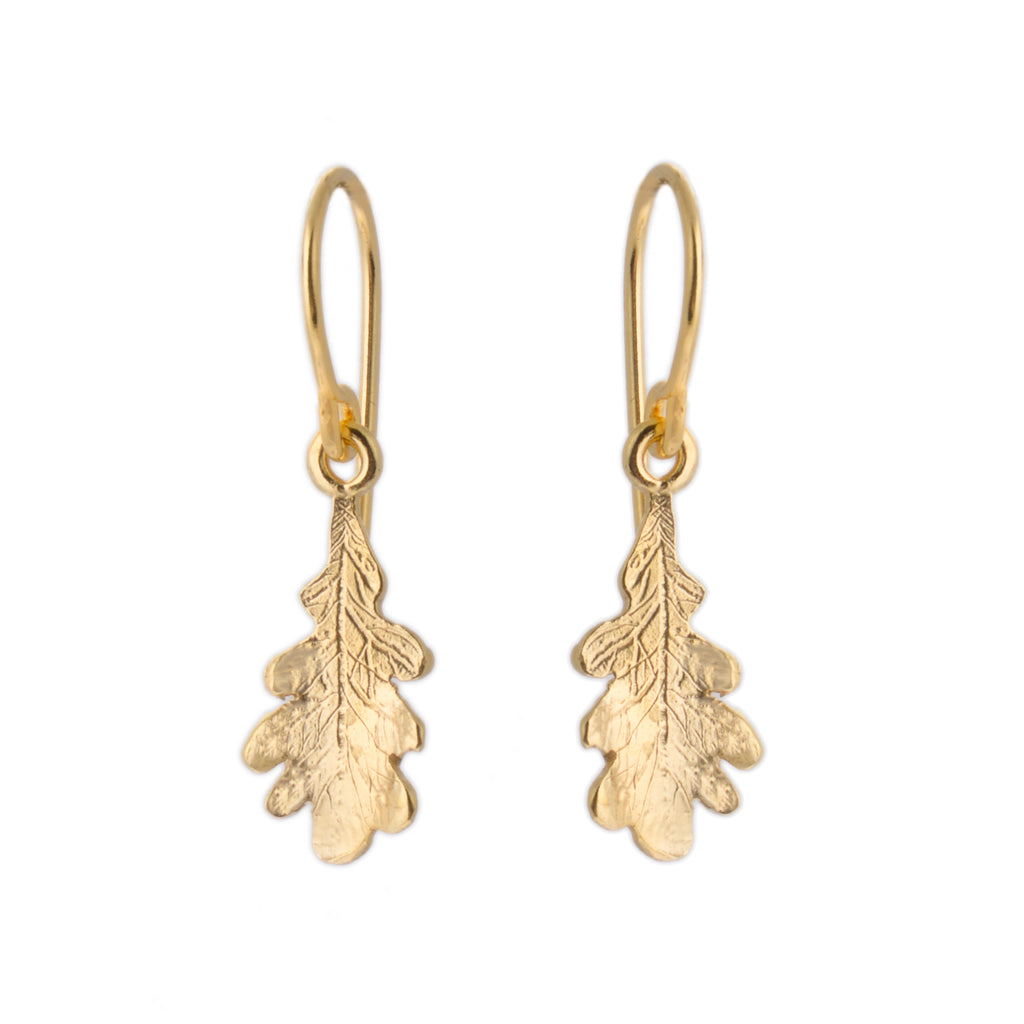 Tiny gold oak leaf charm on gold hook earrings