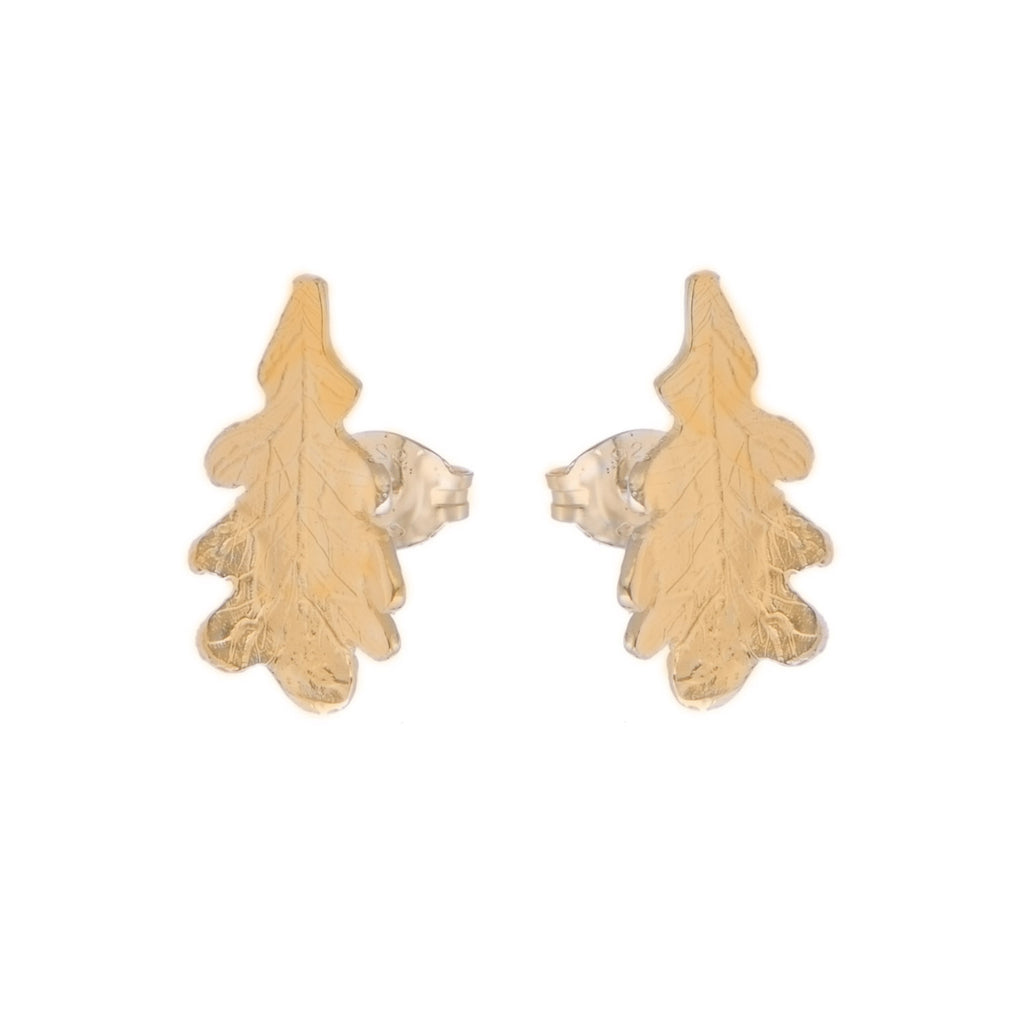 A gold pair of stud earrings in the shape of a tiny oak leaf with a detailed vein pattern