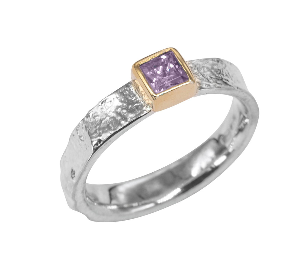 Textured silver ring with a lilac square stone in gold bezel