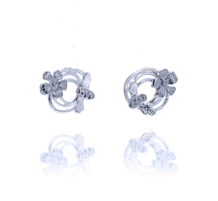 round silver earrings with bee and flower