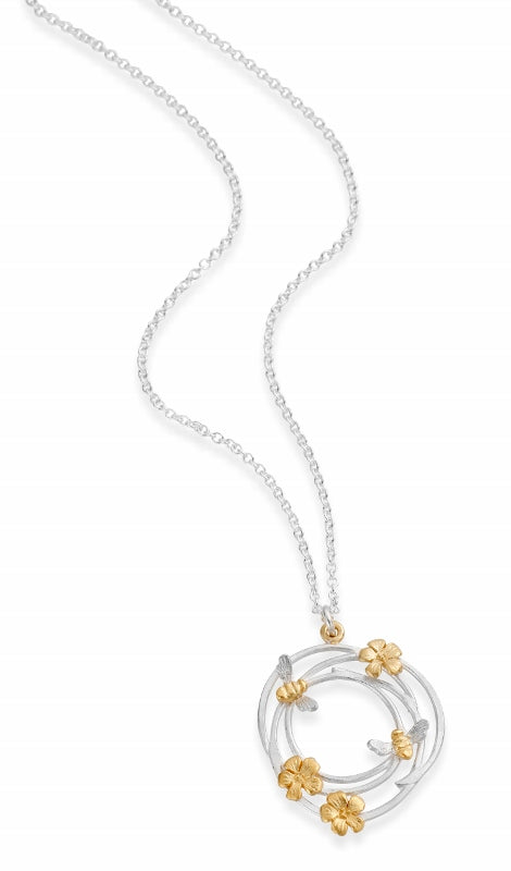 silver necklace with gold bees and flowers