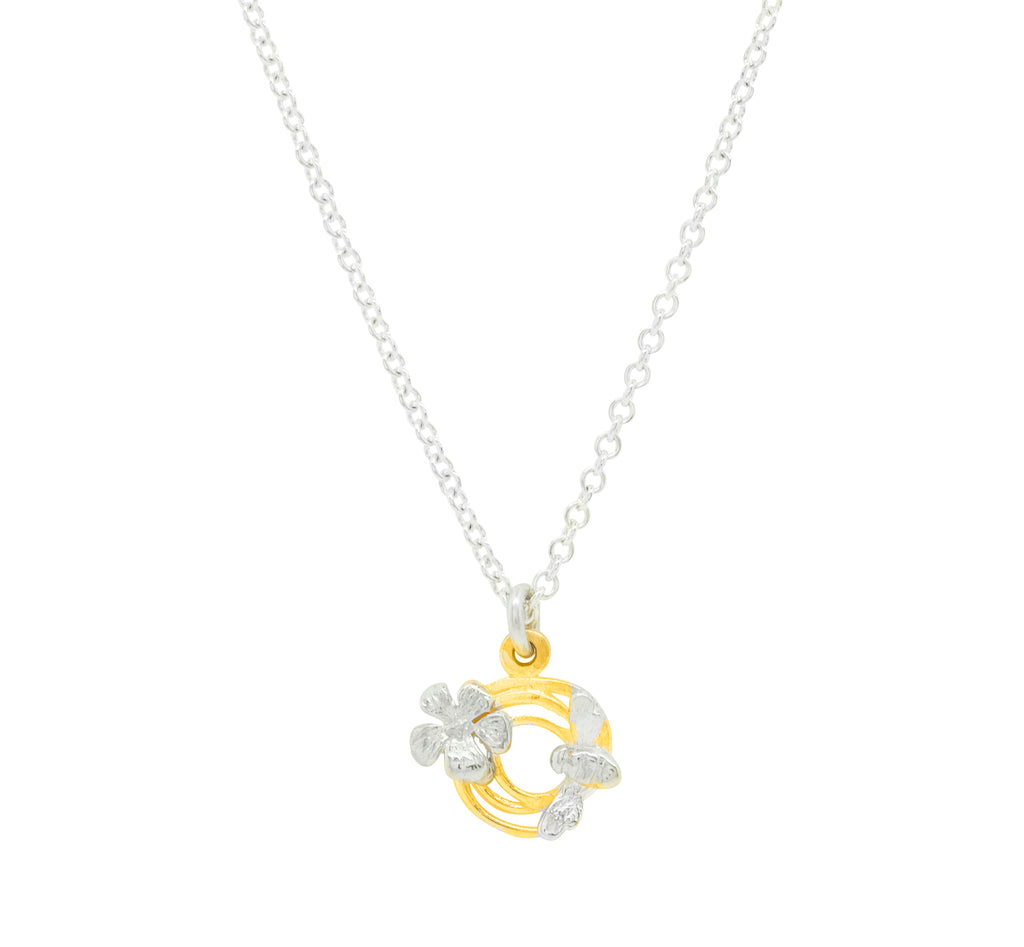 small gold swirl pendant with silver bee and flower on silver necklace