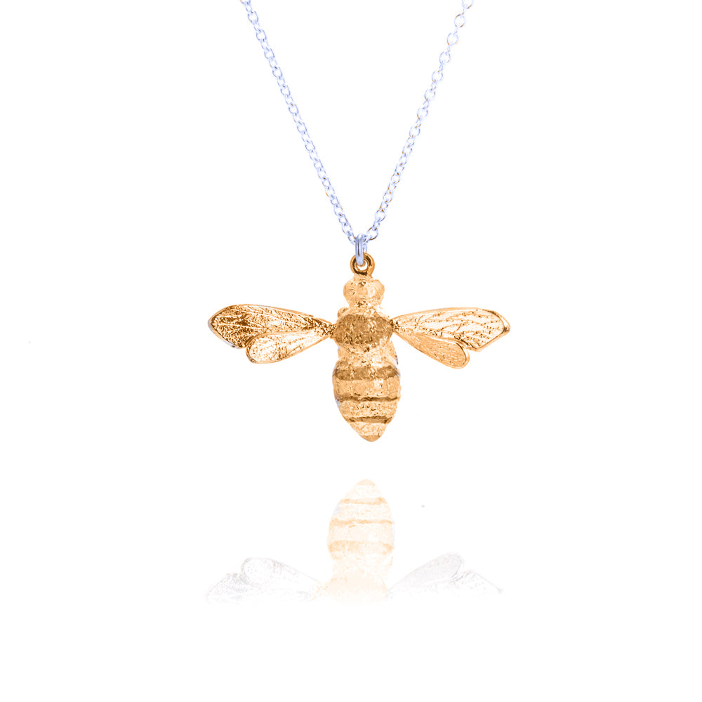 large gold bee pendant on silver chain