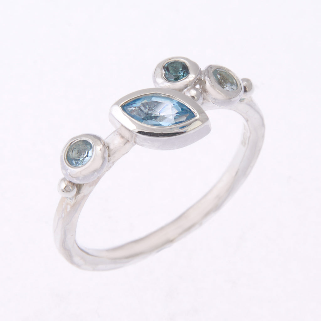 Silver ring with 1 marquise and 3 round blue stones