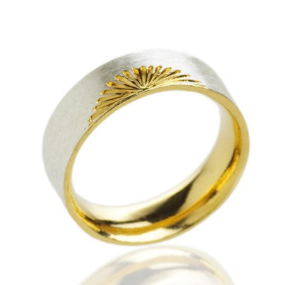 wide silver ring with gold sun