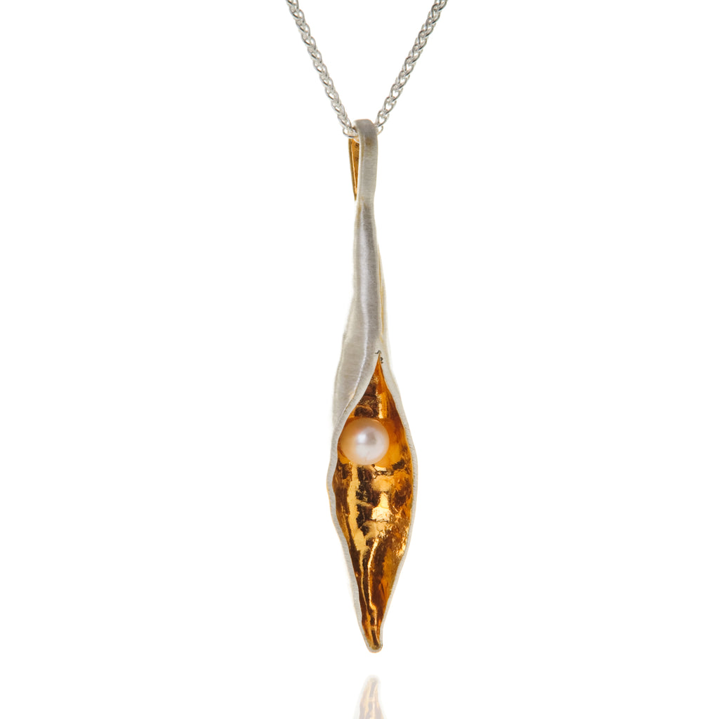 Long silver pod pendant with gold inside and white pearl, on silver chain