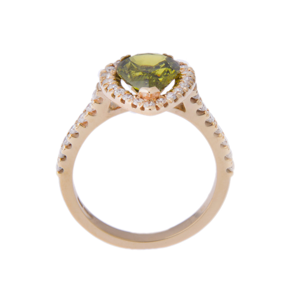 Side view of yellow gold ring with pear shaped halo head
