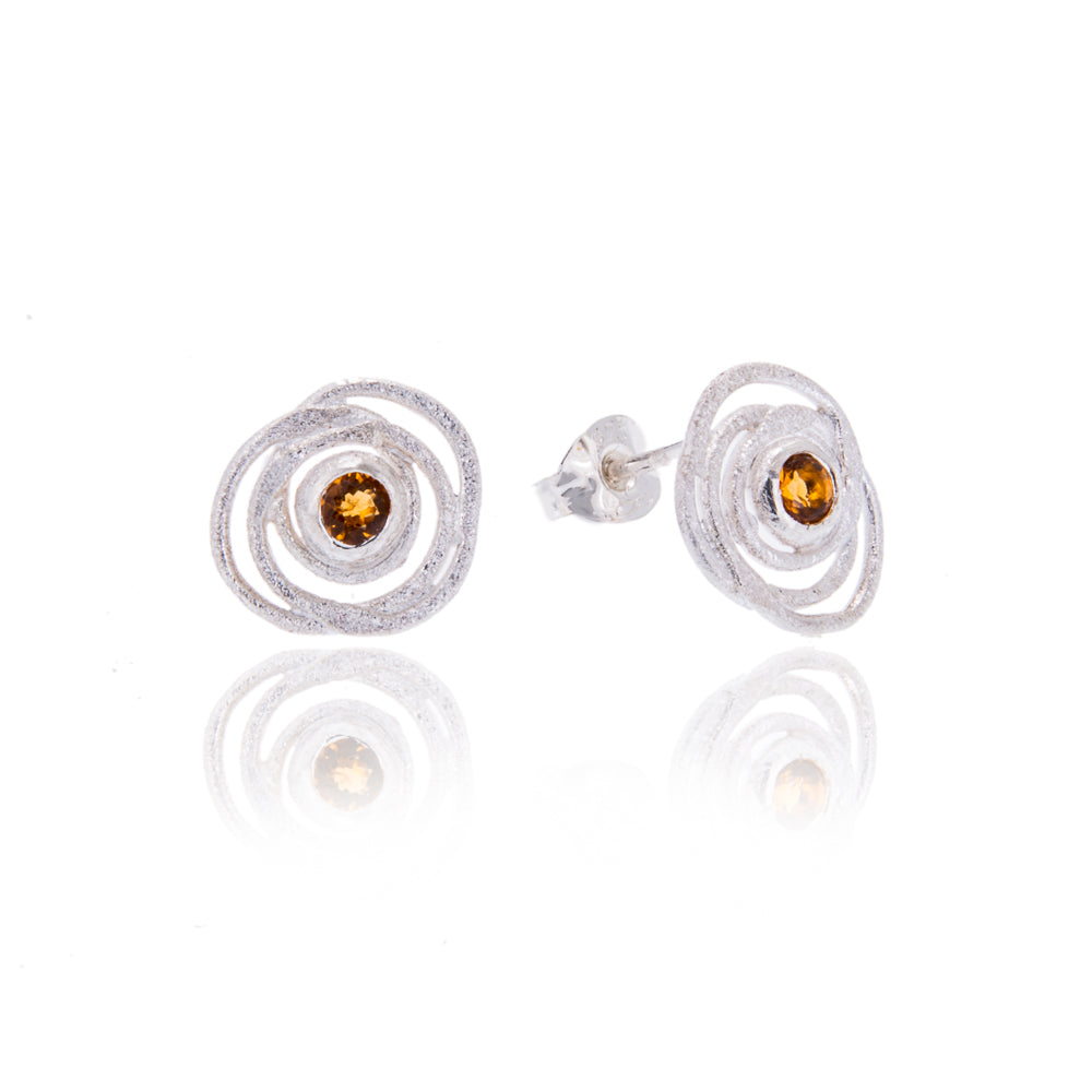 silver swirly earrings with citrine in centre