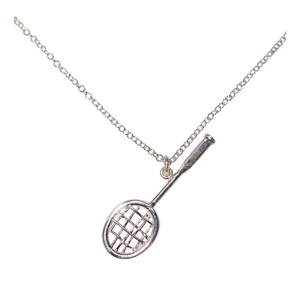 A silver necklace with a small handmade tennis racquet charm in silver