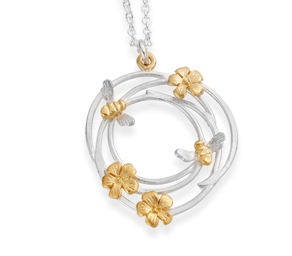 Bees Knees silver swirl necklace with gold plated bees and flowers