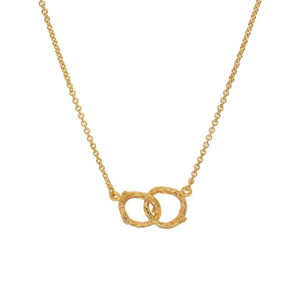 Gold necklace with 2 small interlinked circles with a twig texture on a trace chain