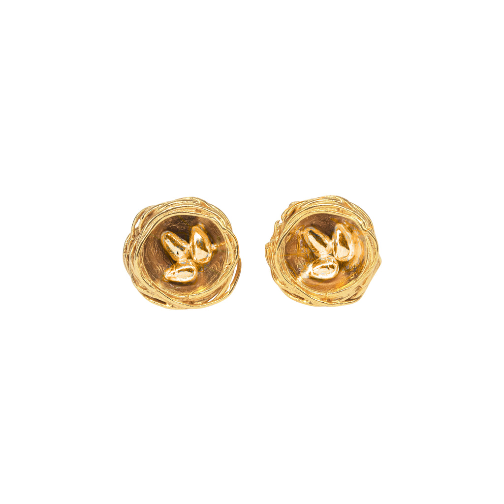 Two textured gold nest shaped earrings with three tiny gold eggs in each