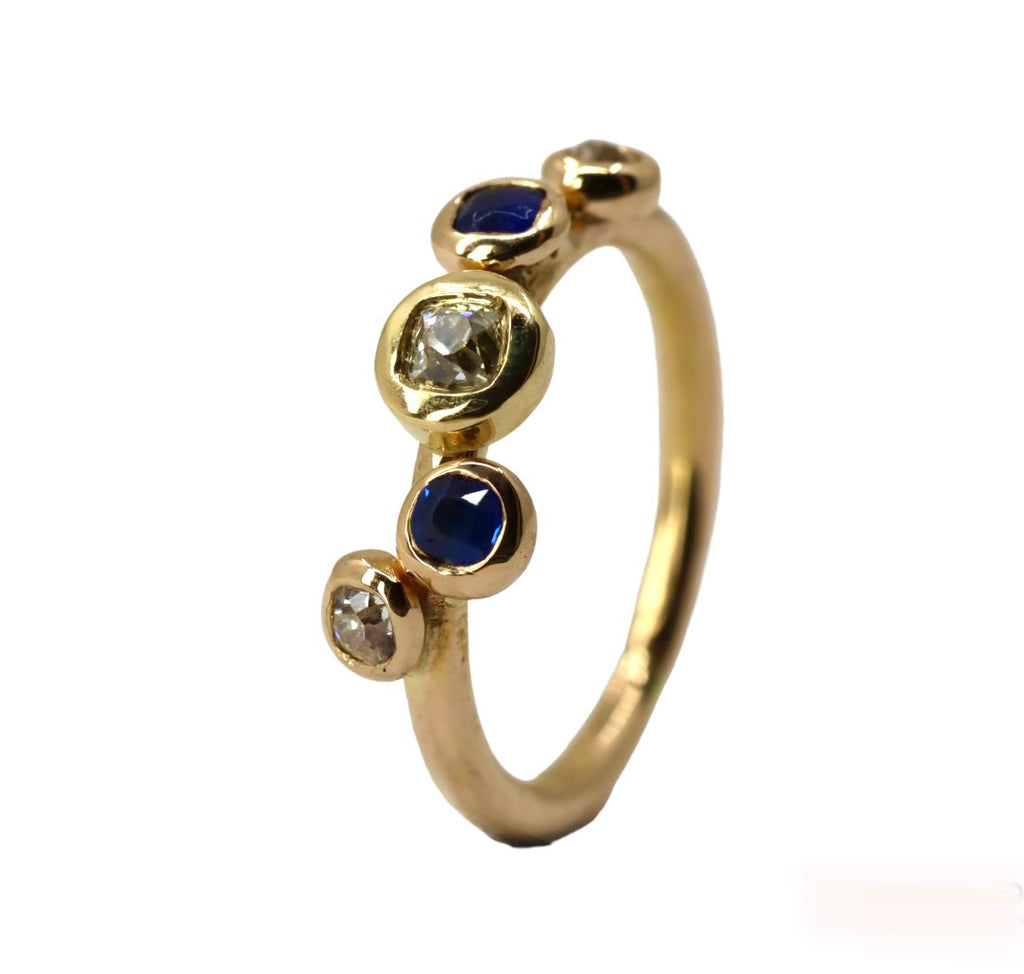 Gold ring set with old cut diamonds and sapphires