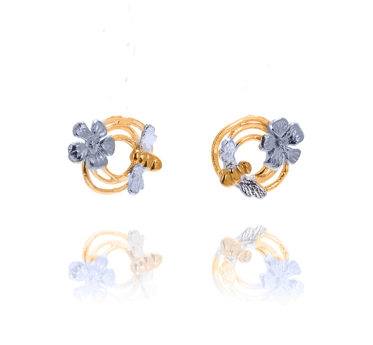 round gold earrings with silver bee and flower