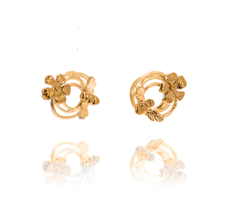 round gold earrings with bee and flower