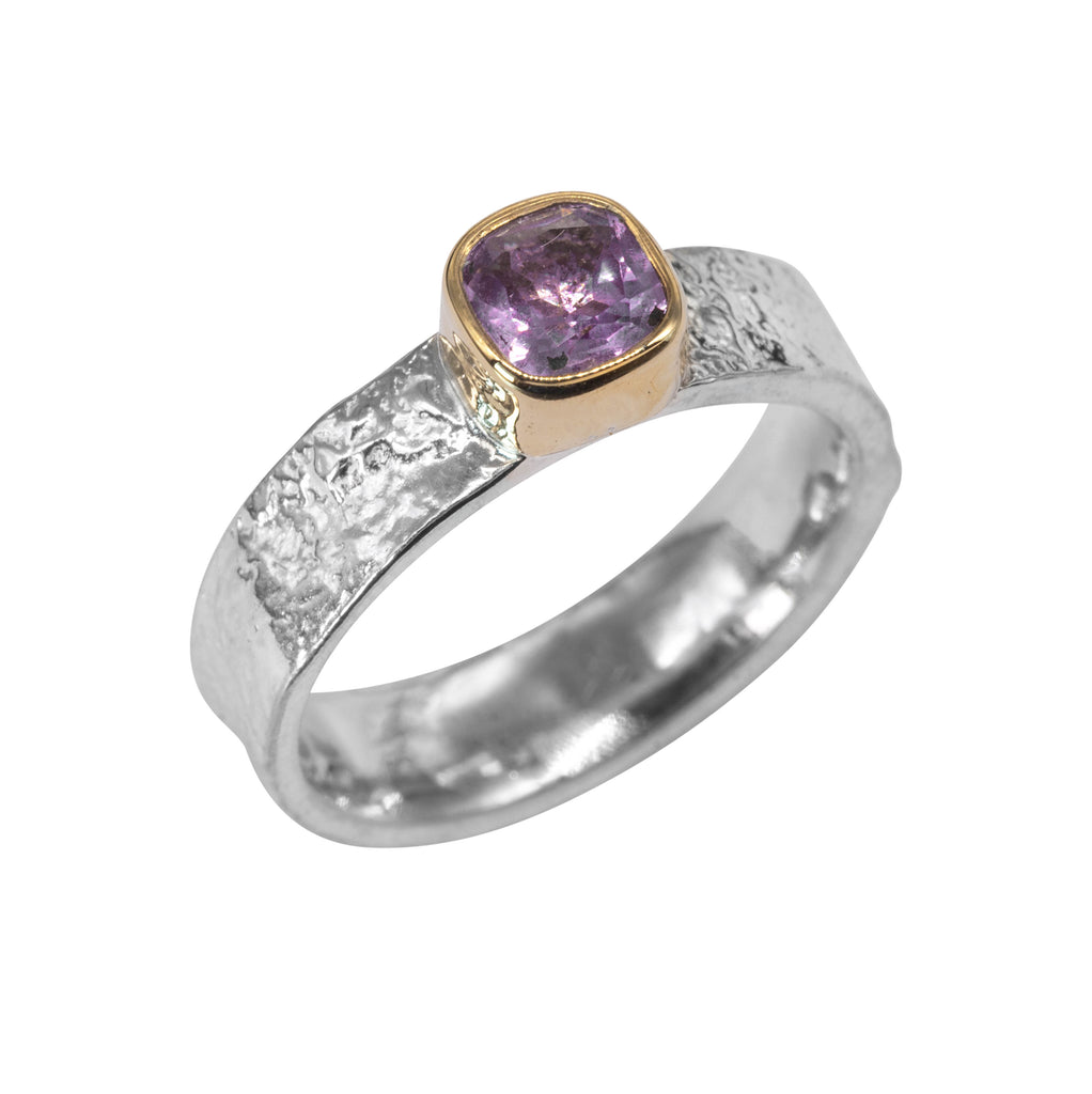 wide silver textured ring with cushion amethyst in gold setting