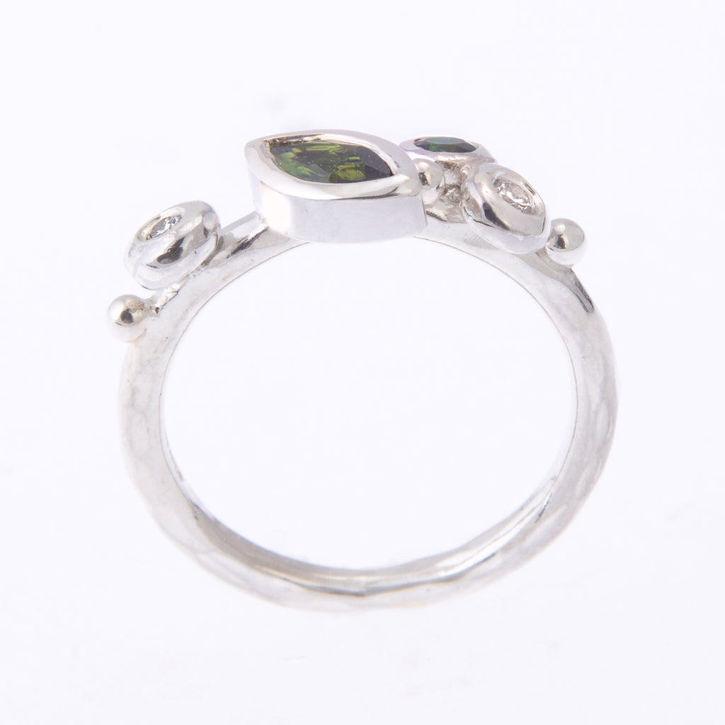 Silver and green stone ring from the side