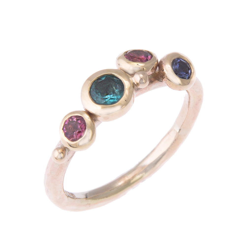 Gold ring with teal, pink and blue gemstones