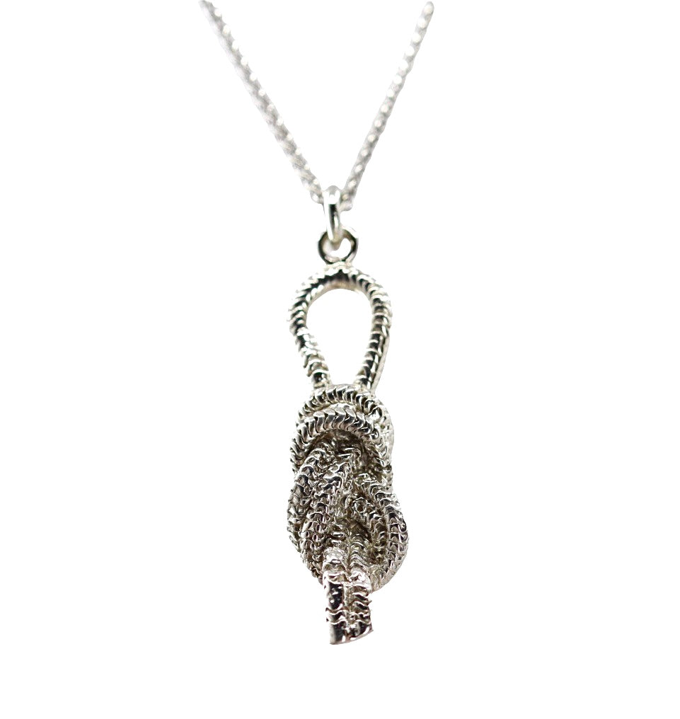 knot shaped white gold pendant on chain