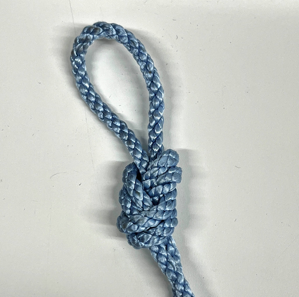 A knot used in indoor rock climbing made in blue rope