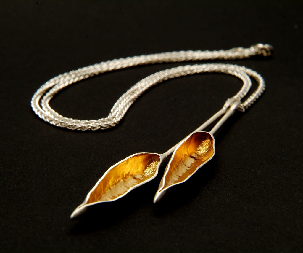 gold and silver pod necklace
