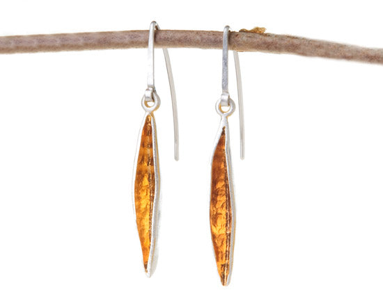 Silver and gold pod earrings on hooks
