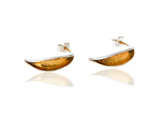 silver curved earrings with a wide opening with gold inside