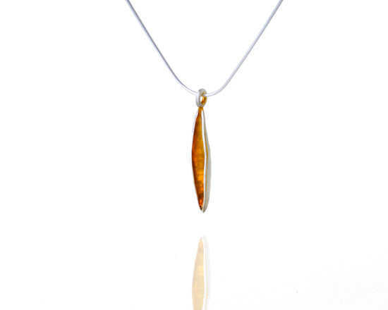 silver and gold pod pendant on chain
