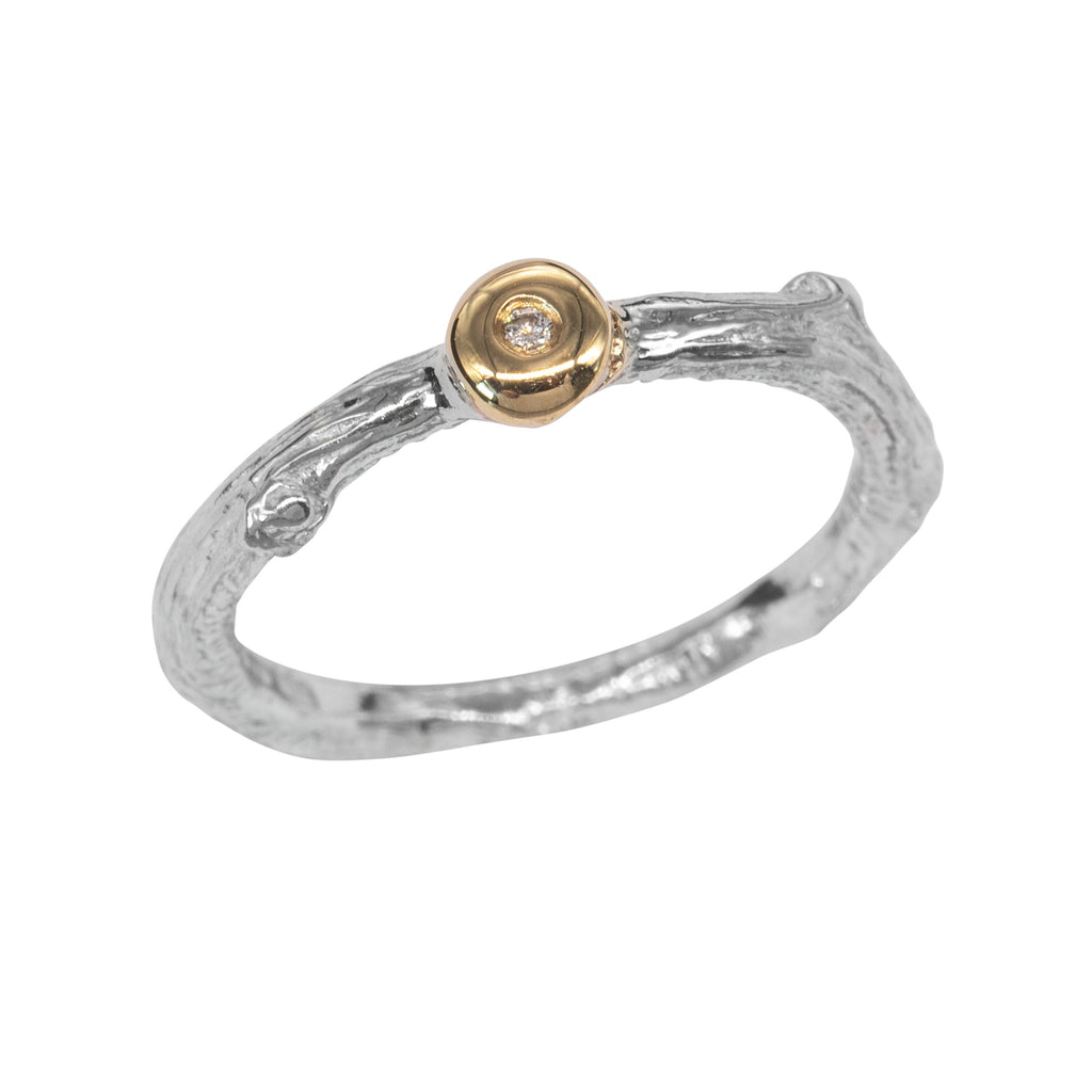 Silver twig ring with diamond set in gold bud