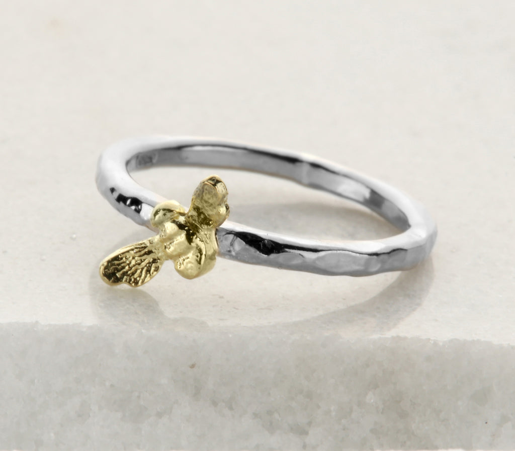 silver ring with gold bee