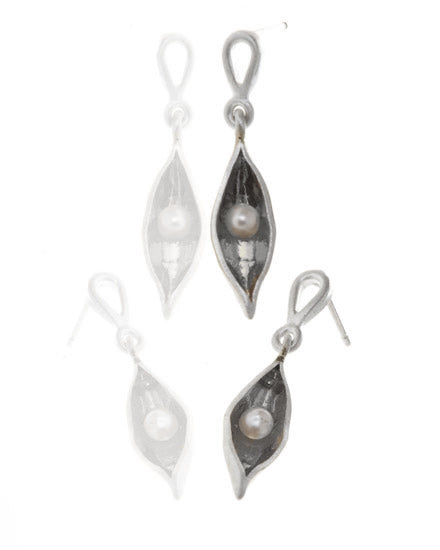 Small silver pea pod earrings hanging from a silver stud, with white pearls inside