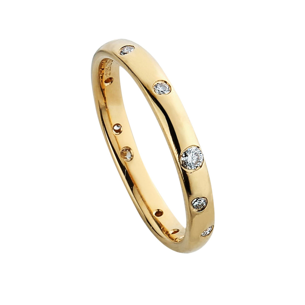 Yellow gold ring with different sizes of diamonds set flush with the surface