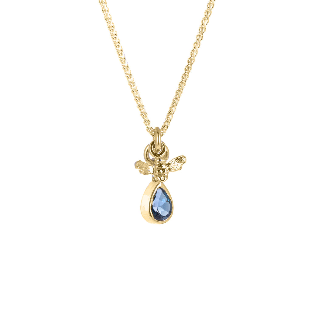 Tiny gold bee pendant and blue gemstone pendant on gold chain